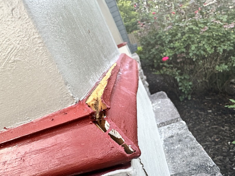 Exterior trim being repaired and primed before paint