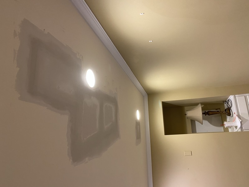 Hallway ceiling with a drywall patch feathered in
