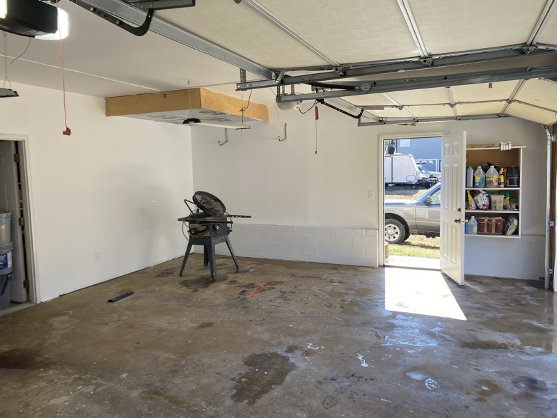 The finished garage with smooth, painted white walls