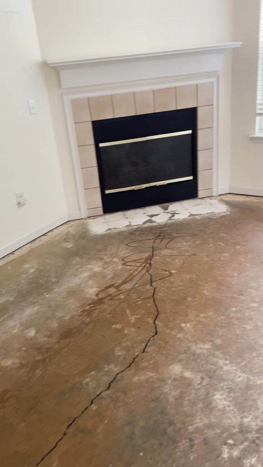 Walkthrough of a living room with the floor prepped before new flooring